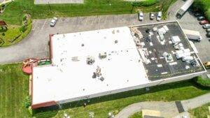 Aerial view of commercial roof restoration project by JB Miller Contractors.